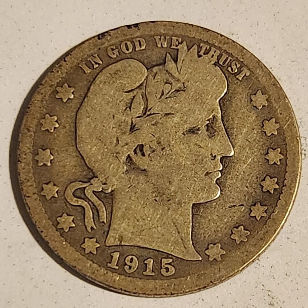 1915-O Barber Quarter Silver Coin.
The 1915-S...